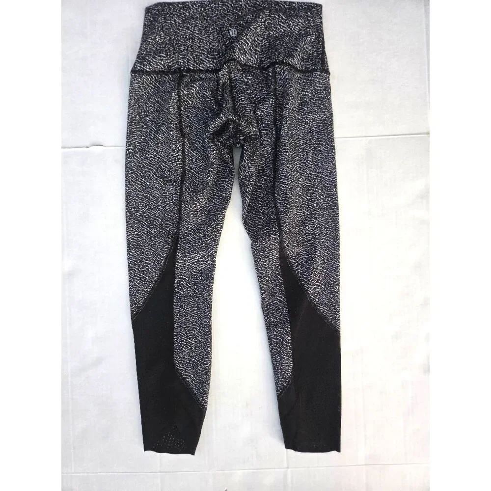 Lululemon • Wunder‎ Under Laser Cut Studio Crop Leggings • Size 8 • Black/White